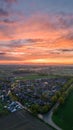 Aerial view of a city skyline at sunset over a rural suburb Royalty Free Stock Photo