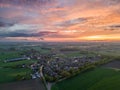 Aerial view of a city skyline at sunset over a rural suburb Royalty Free Stock Photo