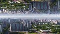 Aerial view of the city in a summer day with nature in the middle of the city, mirror horizon effect. Media. Aerial city Royalty Free Stock Photo