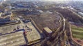 Aerial view of city wasteland and hypermarket parking where huge old factory Royalty Free Stock Photo