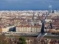 Aerial view of the city wide panorama with landmarks surrounded by red rooftops and chimneys, Lyon, France Royalty Free Stock Photo