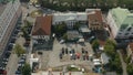 Aerial view of a city yard with ugly facades of houses and many parked cars. Stock footage. Parking located by the Royalty Free Stock Photo