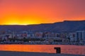 Aerial view of cityscape Manfredonia surrounded by water and buildings during sunset