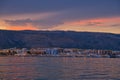 Aerial view of cityscape Manfredonia surrounded by water and buildings during sunset