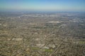 Aerial view of cityscape, view from window seat in an airplane Royalty Free Stock Photo