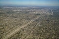 Aerial view of cityscape, view from window seat in an airplane Royalty Free Stock Photo