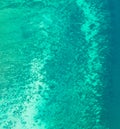 Aerial view of clear blue turquoise seawater, Andaman sea in Phuket island in summer season, Thailand. Water in ocean material