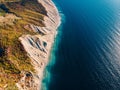 Aerial view of cliff coastline and sea with waves Royalty Free Stock Photo