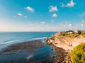 Aerial view of cliff, rocks and ocean at low tide in Bali Royalty Free Stock Photo