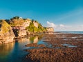 Aerial view of cliff, rocks and ocean at low tide in Bali Royalty Free Stock Photo