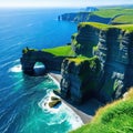 Aerial view of the Cliffs of Moher in beautiful blue ocean and green grassy Royalty Free Stock Photo