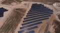 Aerial view of close up solar power panels, in desert. Royalty Free Stock Photo