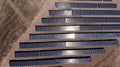 Aerial view of close up solar power panels, in desert. Royalty Free Stock Photo