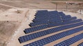 Aerial view of close up solar power panels, in desert. Royalty Free Stock Photo