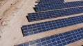 Aerial view of close up solar power panels, in desert. Royalty Free Stock Photo