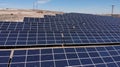 Aerial view of close up solar power panels, in desert. Royalty Free Stock Photo