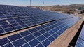 Aerial view of close up solar power panels, in desert. Royalty Free Stock Photo