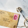 Aerial view closeup of brown envelope on marbel table