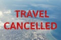 Aerial view of cloud, sea, ocean, city landscape from airplane with text flight cancelled. Flight cancellation due to impact of Royalty Free Stock Photo