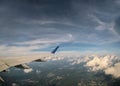 Aerial view of cloud and sky with airplane wing from window Royalty Free Stock Photo