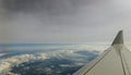 Aerial view of cloud and sky with airplane wing from window Royalty Free Stock Photo