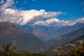 Aerial view of clouds floating over rural mountains in Bhutan, Nepal Royalty Free Stock Photo