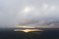 Aerial view sunset over the forest and lake. Top view. View from drone. Aerial top view cloudscape. Texture of clouds. View from a Royalty Free Stock Photo