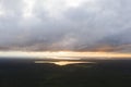 Aerial view sunset over the forest and lake. Top view. View from drone. Aerial top view cloudscape. Texture of clouds. View from a Royalty Free Stock Photo