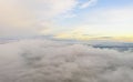 Aerial view clouds over the forest and lake . View from drone. Aerial top view cloudscape. Texture of clouds. View fog over forest Royalty Free Stock Photo