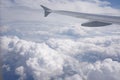 Aerial view on cloudy skies from airplane window Royalty Free Stock Photo