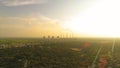 Aerial view of coal power plant -Smoke from Factory Chimnys - Sunrise at green covered city with factories outside the city,