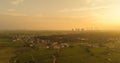 Aerial view of coal power plant - Sunrise near green agriculture field with factories outside the city, Raichur, India