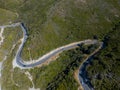 Aerial view of the coast of Corsica, winding roads and coves with crystalline sea. France Royalty Free Stock Photo