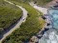 Aerial view of the coast of Corsica, winding roads and coves with crystalline sea. France Royalty Free Stock Photo