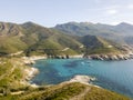 Aerial view of the coast of Corsica, winding roads and coves with crystalline sea. Gulf of Aliso. France Royalty Free Stock Photo