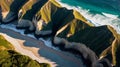 Aerial View of Coastal Cliffs and Sandy Beach at Sunrise Royalty Free Stock Photo