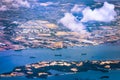 Aerial view of coastal construction or port areas in Strait of Malacca, on airplane route to Malaysia or Singapore