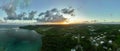 Aerial view of a coastal town at sunset. Pago Bay, Guam.