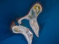 Aerial view of coastline with blue sea, island and lighthouse in Utrish, Anapa