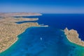 Aerial view of the coastline of Crete surrounded by the clear waters of the Aegean Sea