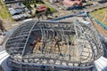 Aerial view of a coliseum with a collapsed metal structure and undergoing structural inspections Royalty Free Stock Photo