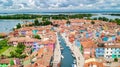 Aerial view of colorful Burano island houses in Venetian lagoon sea from above, Italy