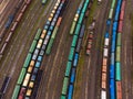 Aerial view of colorful cargo trains on railway tracks
