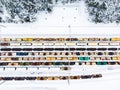 Aerial view of colorful freight train cars on the railway station. Wagons with goods on railroad. Industrial conceptual scene with Royalty Free Stock Photo