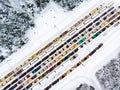 Aerial view of colorful freight train cars on the railway station. Wagons with goods on railroad. Industrial conceptual scene with Royalty Free Stock Photo