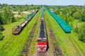 Aerial view of colorful freight trains. Cargo wagons on railway station. Wagons with goods on railroad. Heavy industry. Industrial Royalty Free Stock Photo