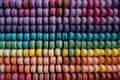 aerial view of colorful macarons arranged in rows