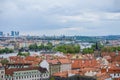 Aerial view of the colorful orange roofs of old houses in the city of Europe Prague