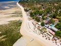 Aerial view of colorful sun loungers and parasols on a small tropical beach (Gili Islands, Lombok, Indonesia Royalty Free Stock Photo