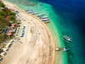 Aerial view of colorful sunshades on a tropical beach (Gili Air, Indonesia Royalty Free Stock Photo